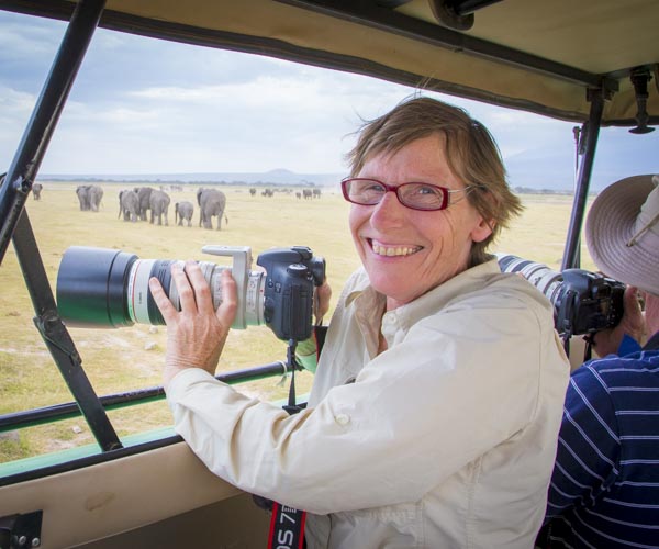photo tour guest with elephants